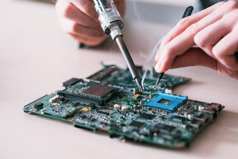 Electronic,Renovation,In,Repair,Shop.,Engineer,Soldering,Computer,Motherboard