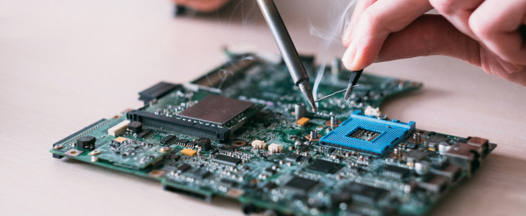 Electronic,Renovation,In,Repair,Shop.,Engineer,Soldering,Computer,Motherboard