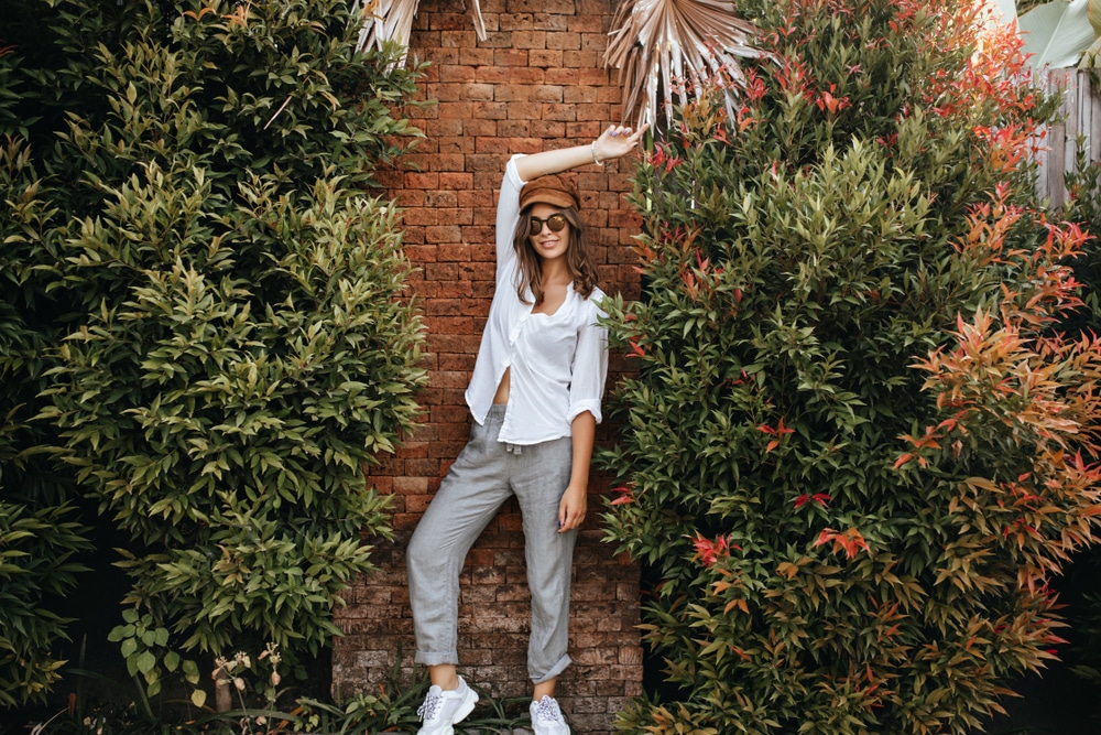 Slim,Lady,In,White,Sneakers,,Gray,Pants,And,White,Oversized